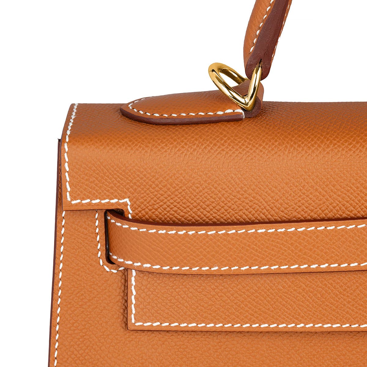 Detail view of the white stitching on the Hermes Kelly Sellier 28 in Epsom Gold leather with gold hardware