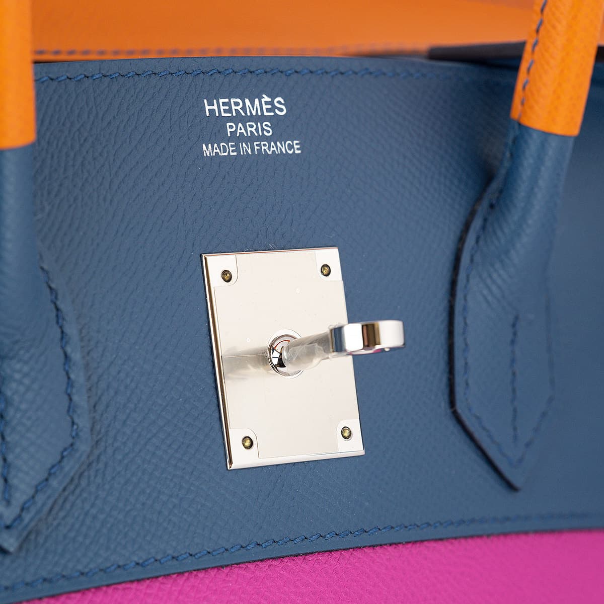 Close up showing Hermes logo with silver touret.