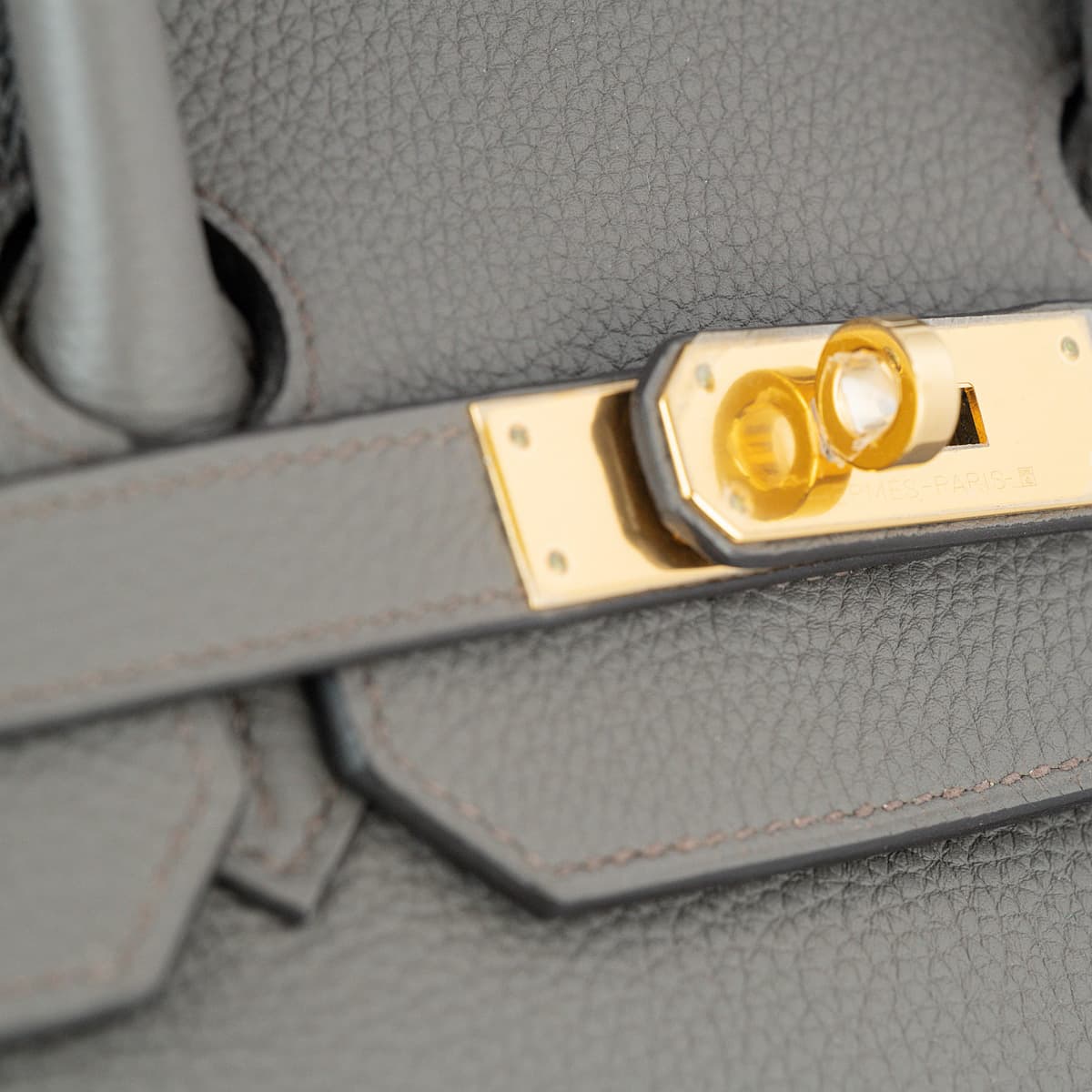 Close up of the Hermes Birkin 35 gold touret and plaque.
