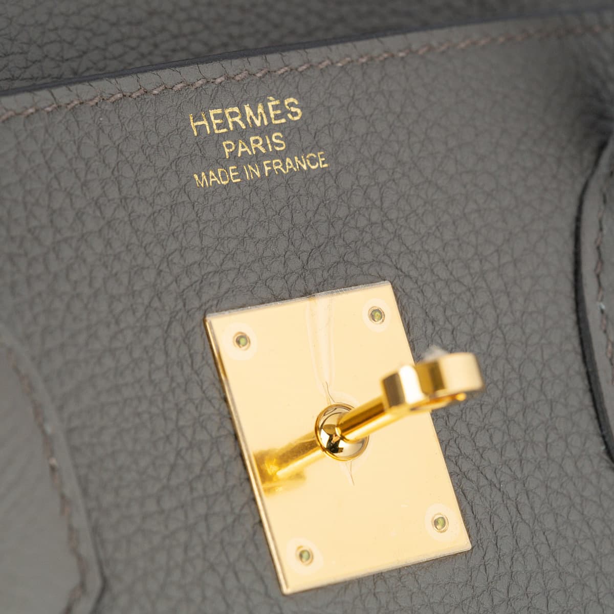 Hermes Birkin 35 light grey leather with gold touret and gold logo.