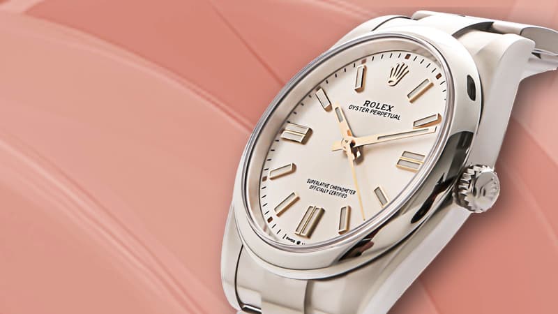 Rolex Oyster Perpetual with silver dial and stainless steel bracelet.