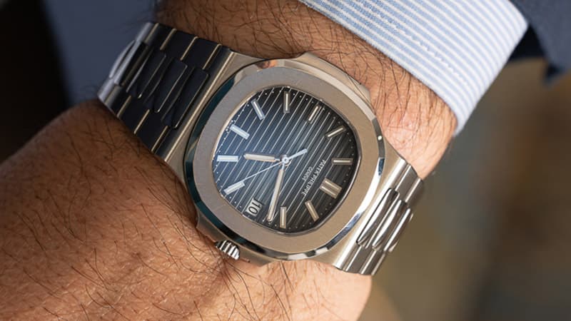 Patek Philippe Nautilus 5711/1A with blue dial and steel case on the wrist of a man