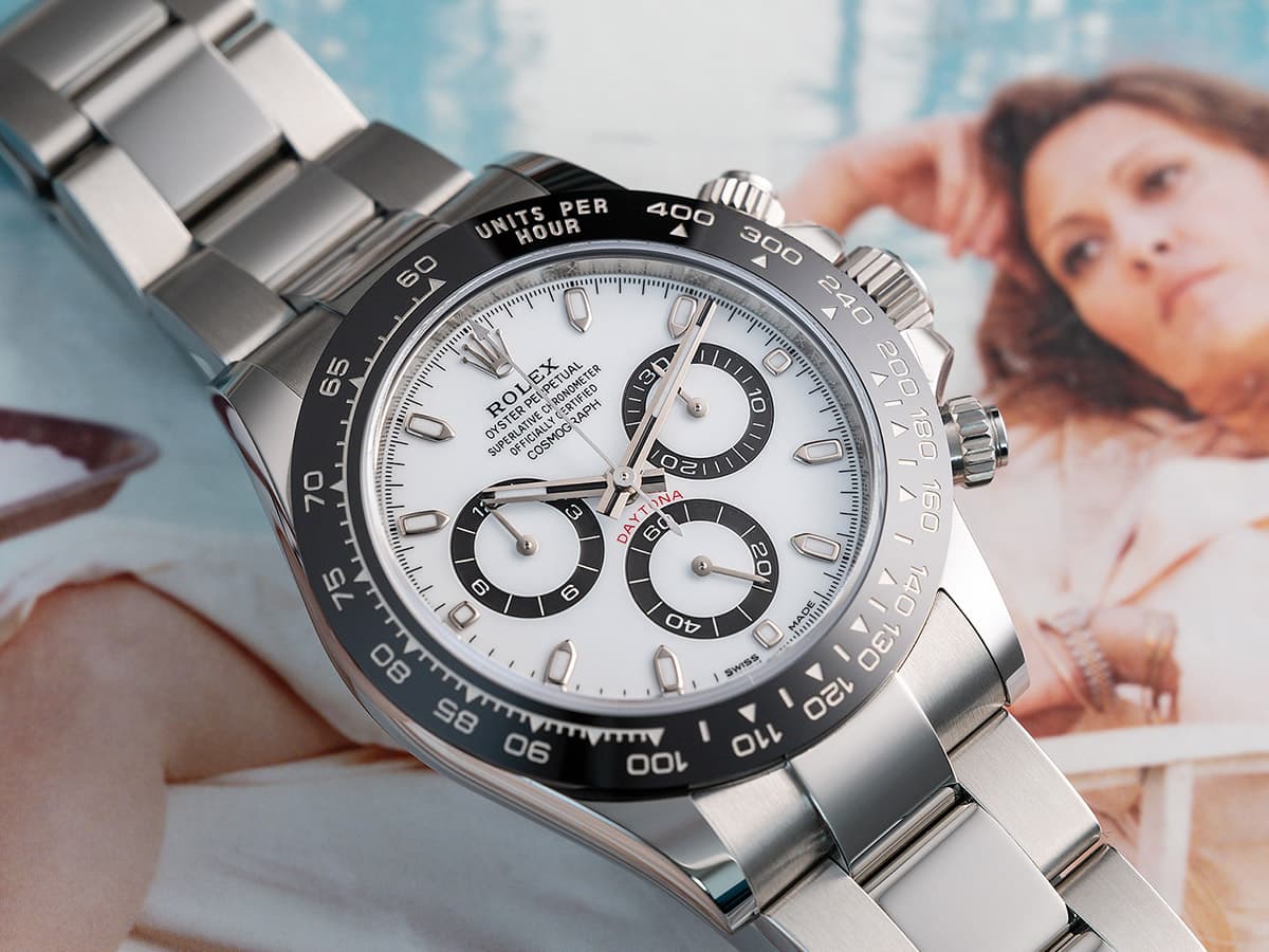 The white dial of the Rolex Daytona Panda, a chronograph watch with its characteristic three small subdials with black rims.