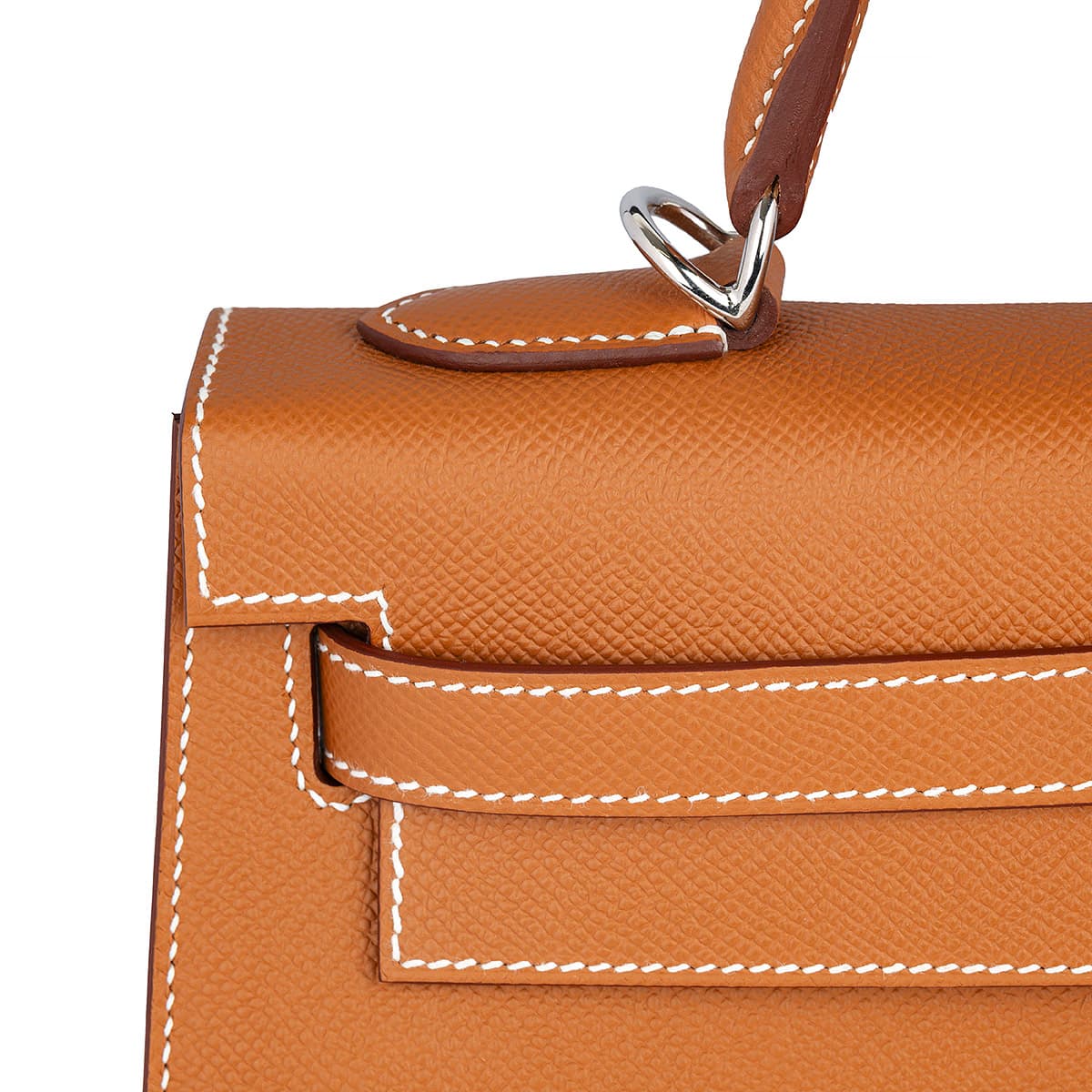 Detail view of the white stitching on the Hermes Kelly Sellier 28 in Epsom Gold leather with palladium hardware
