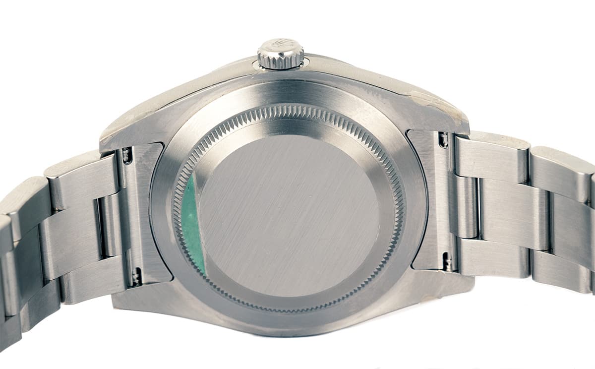 a close up of back case of oystersteel watch