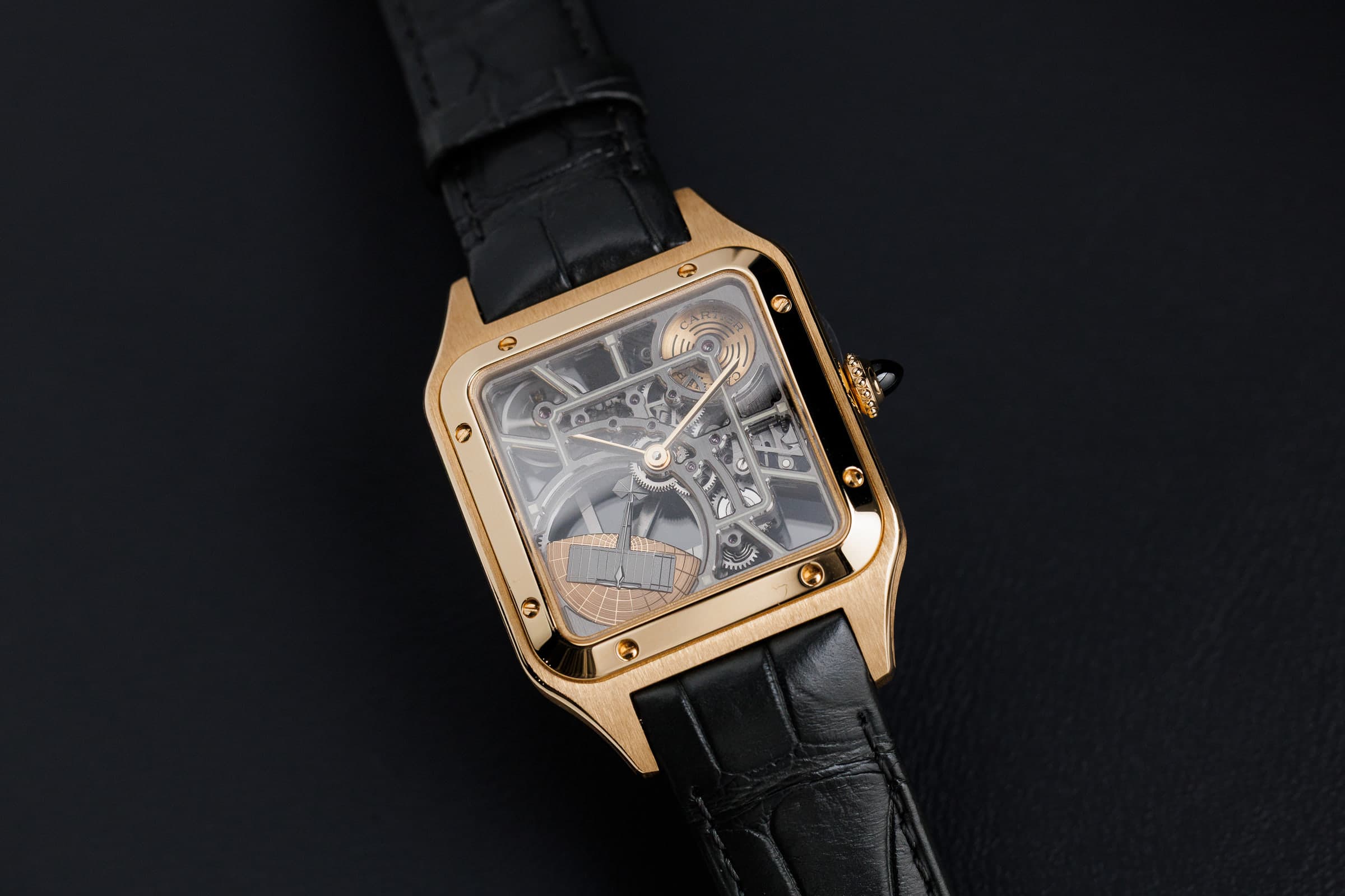 Cartier Santos-Dumont Skeleton WHSA0043 in gold, three-quarter view on the strap