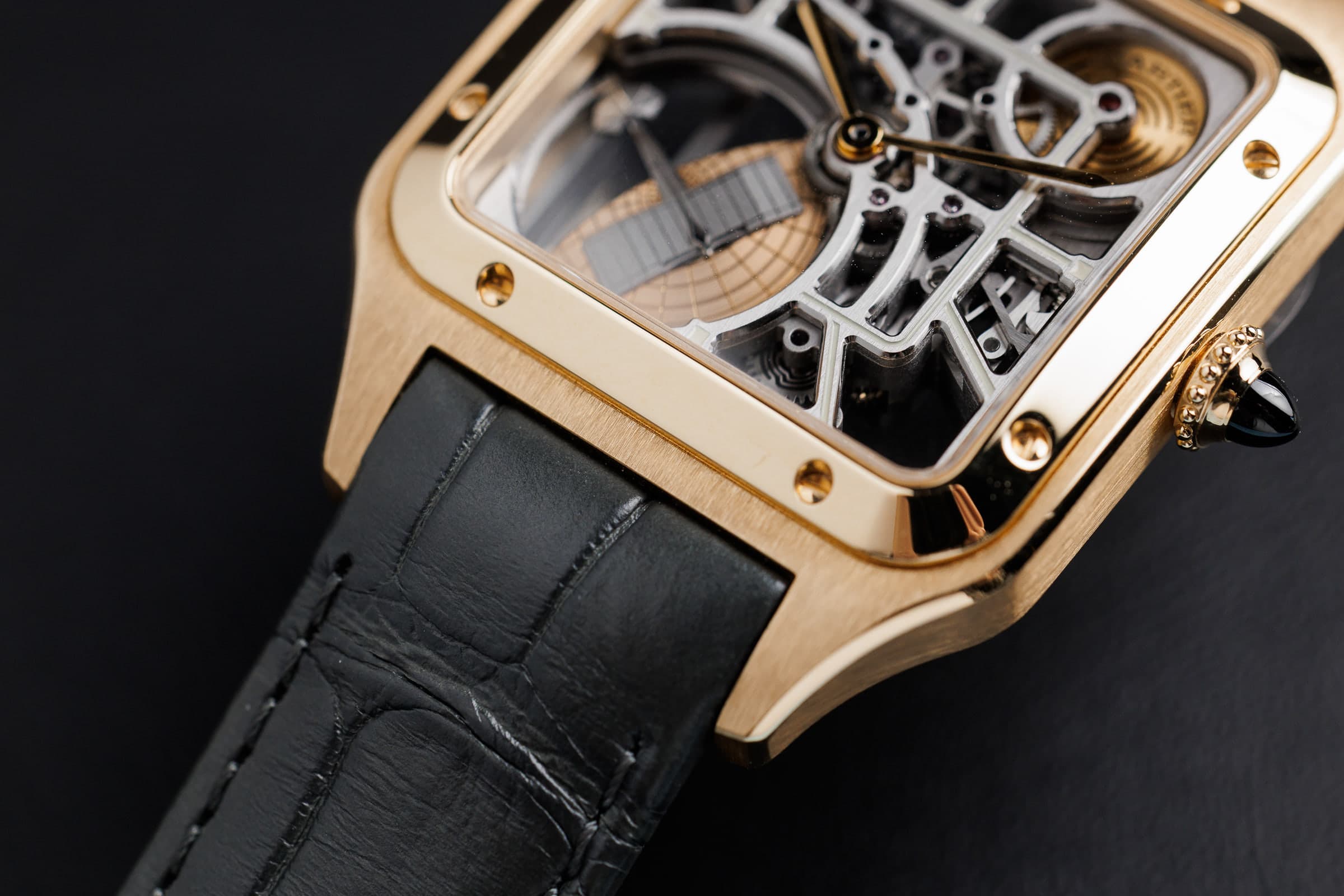 Cartier Santos-Dumont Skeleton WHSA0043 in gold, case and skeleton dial detail
