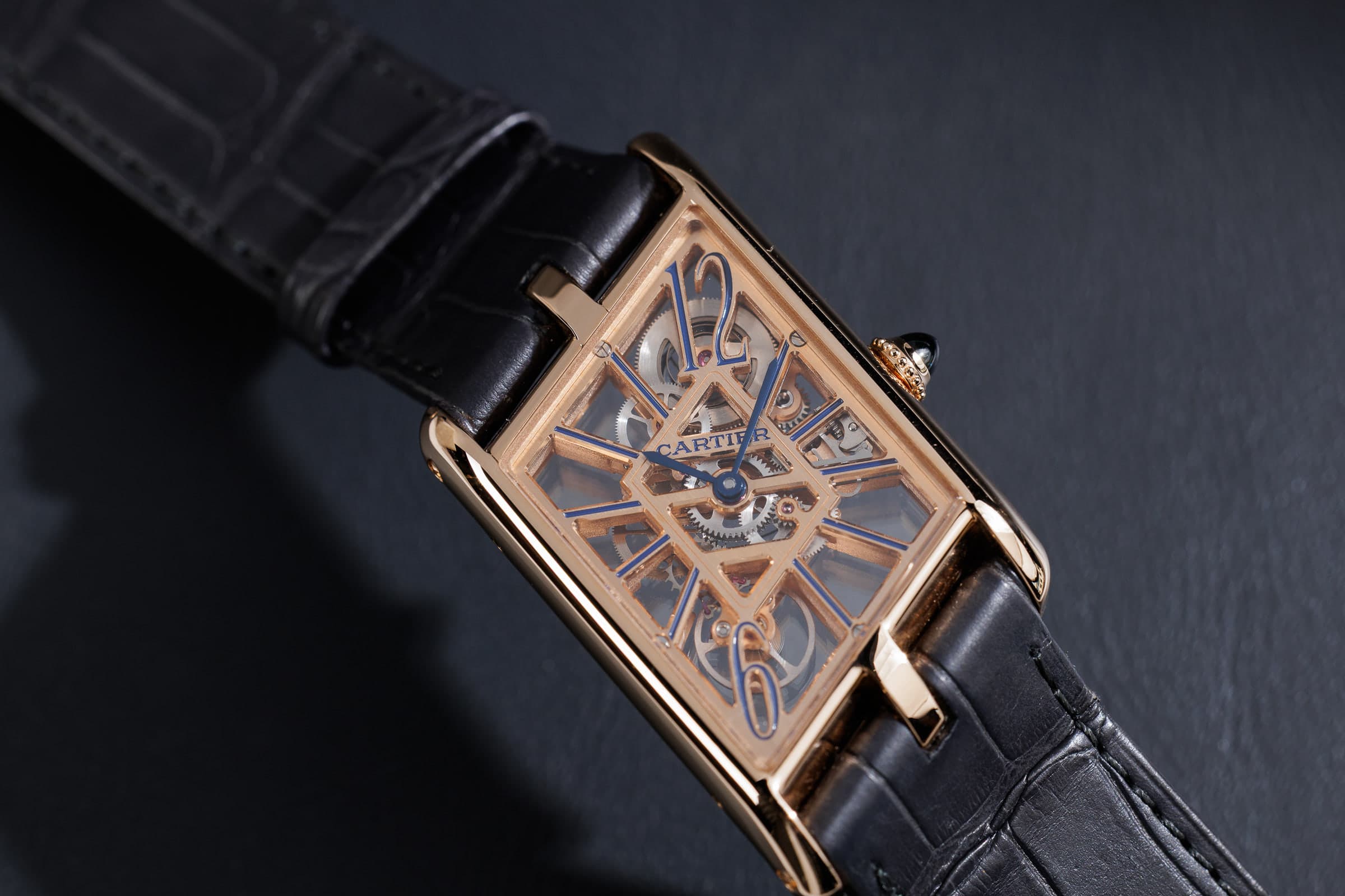 Cartier Tank Asymétrique Skeleton WHTA0011 in rose gold, three-quarter view on the strap