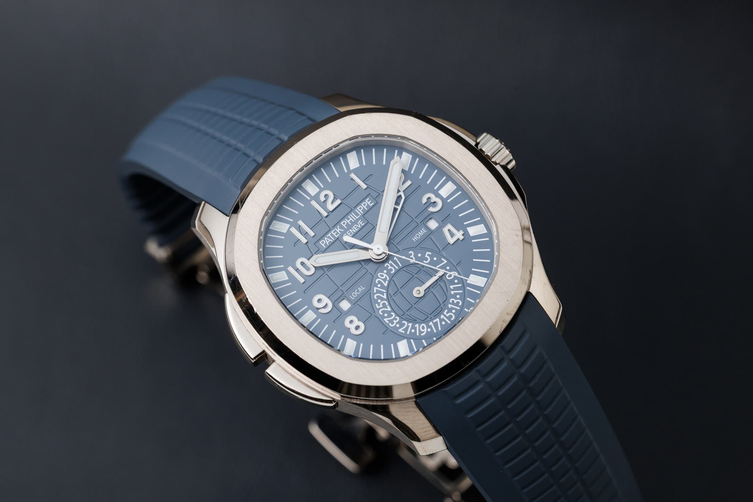 Patek Philippe Aquanaut Travel Time 5164G-001 in white gold, on the blue strap